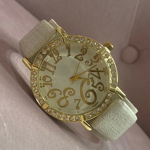 Woman beige and gold watch